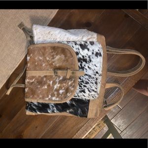 Cowhide backpack with multiple pockets